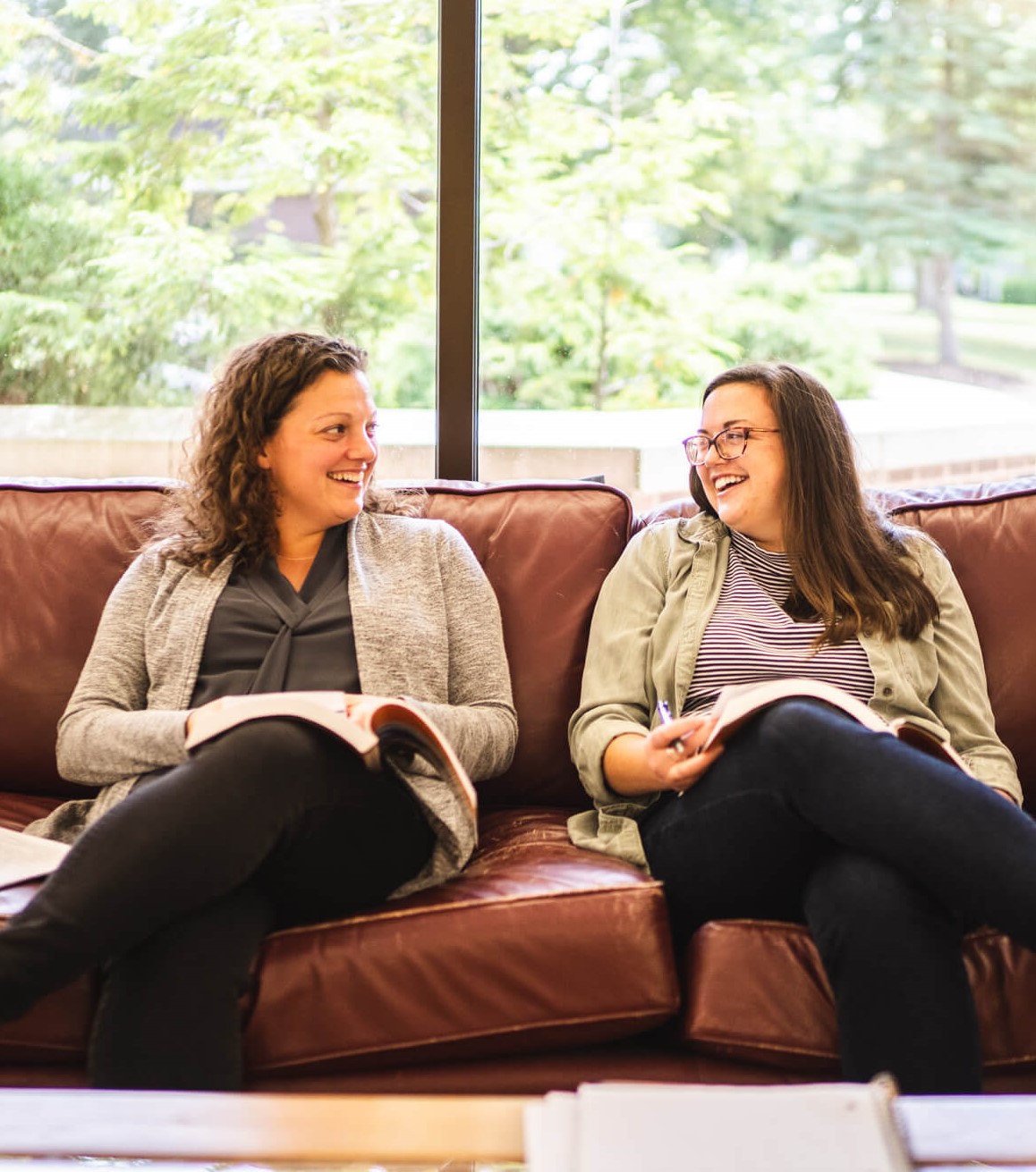 students sitting on couch studying
