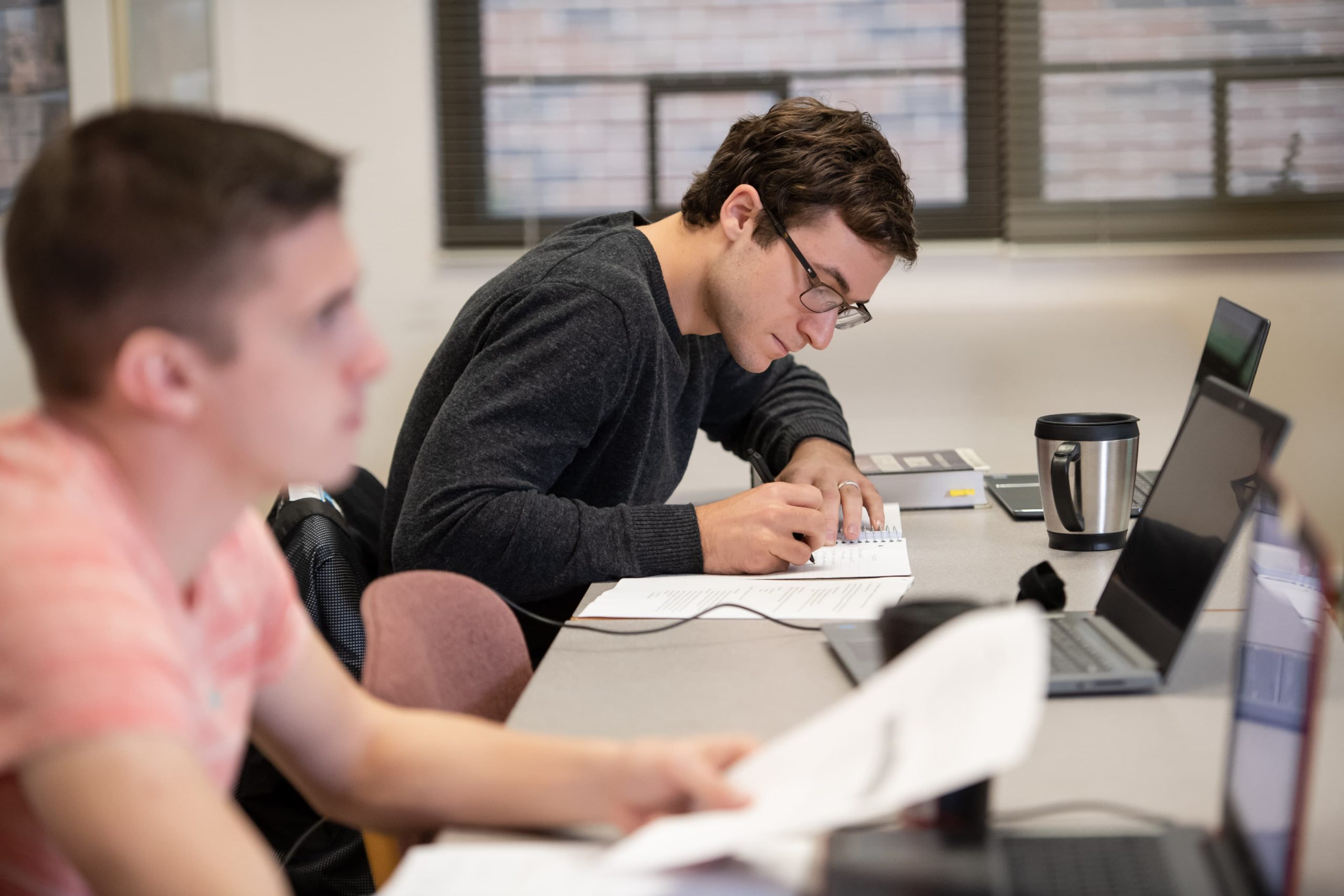 Student taking notes in class