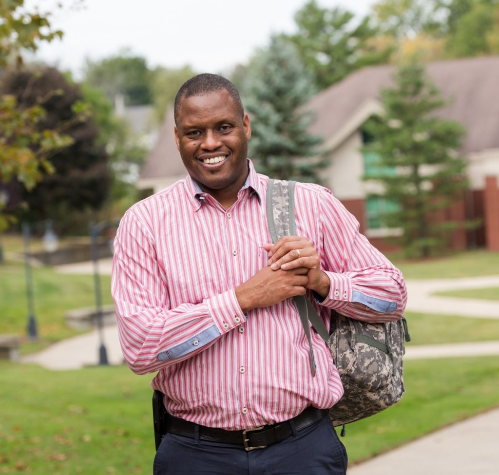 student walking across campus