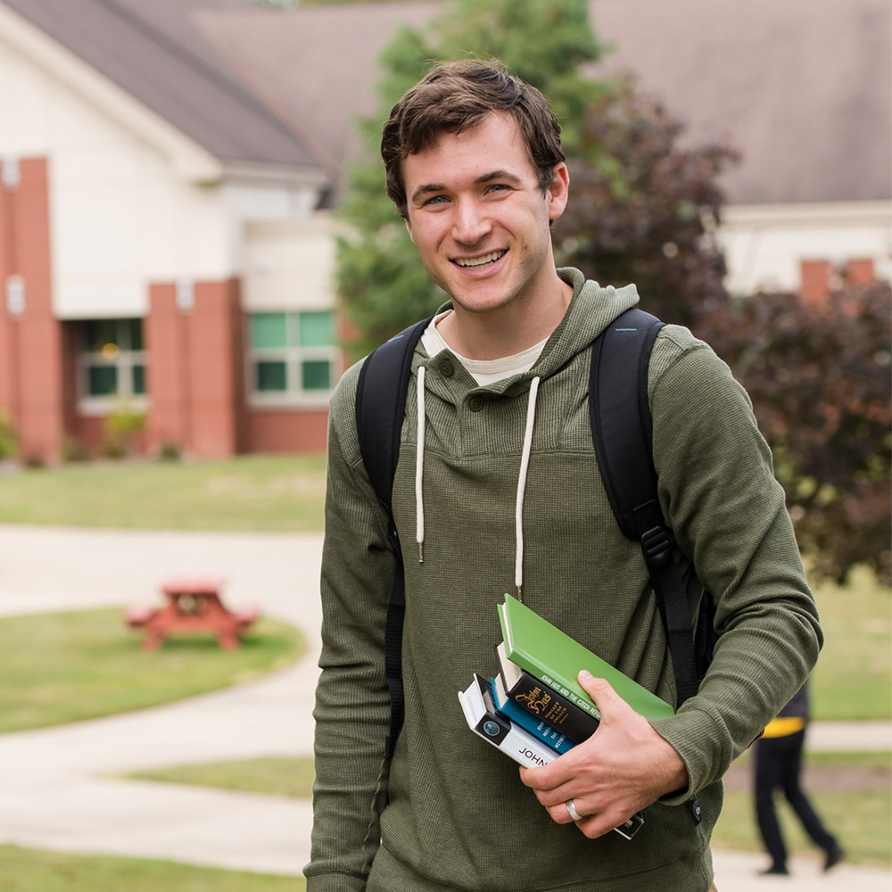 Seminary student walking on campus